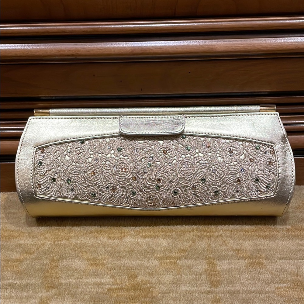 Stuart Weitzman Gold Clutch with Elegant Cylindrical Design